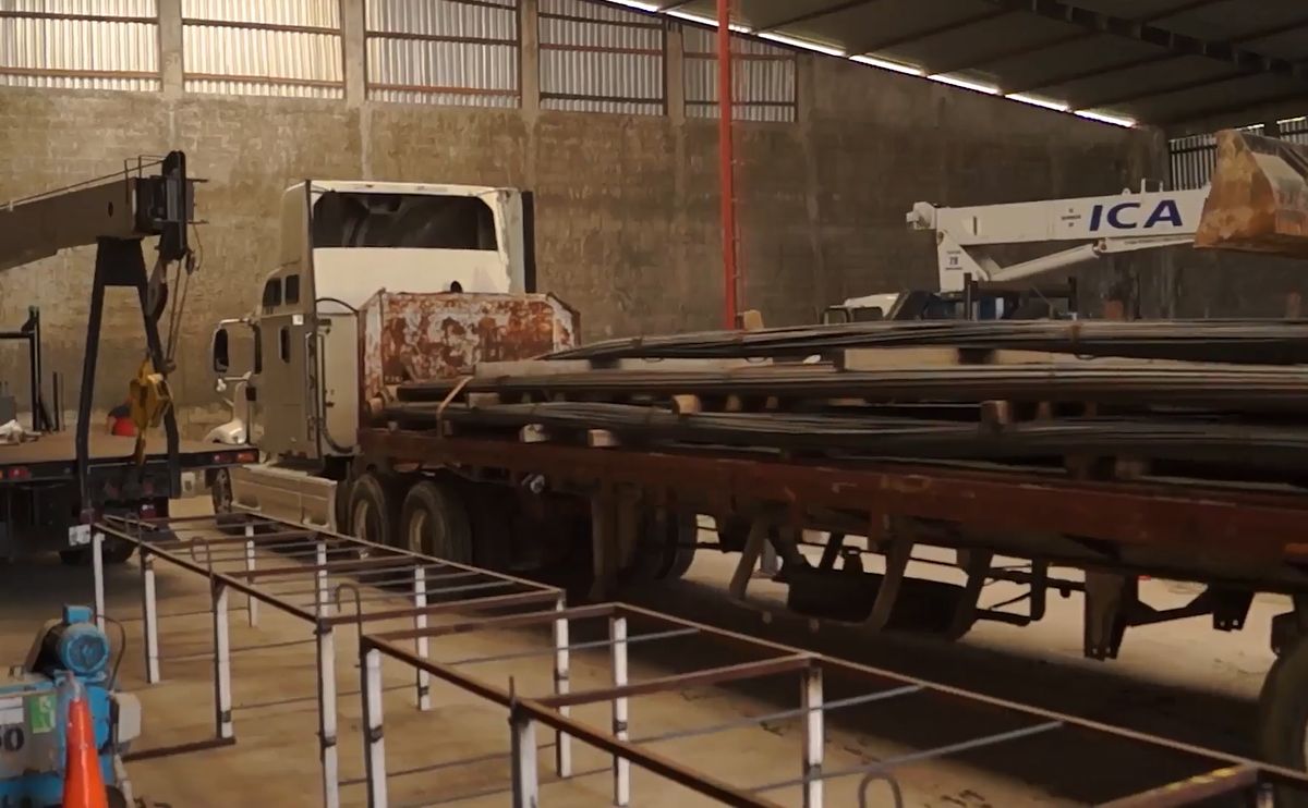 CCT workshop with steel pipe, fabrication frames and service truck
